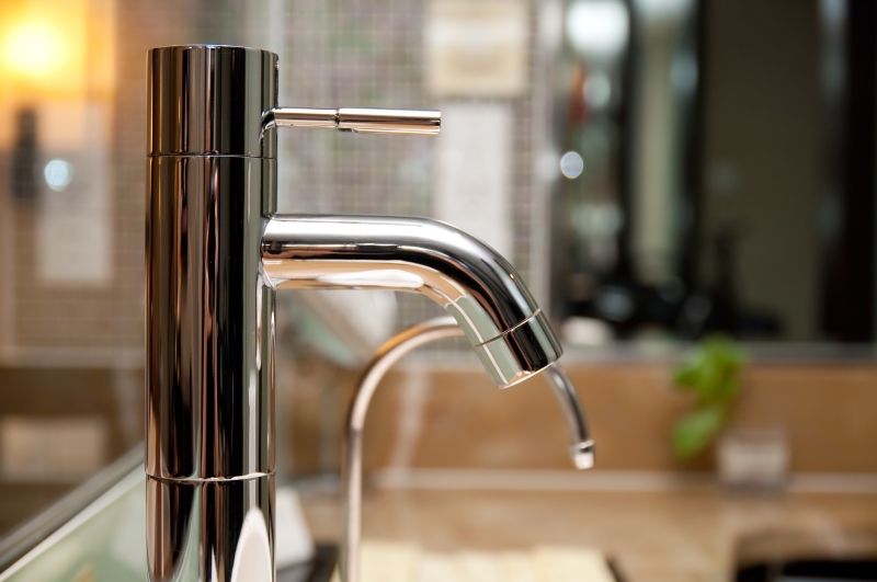 Leaking tap being repaired in Twickenham